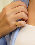 Oval yellow gold signet ring