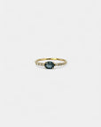 Ring with teal blue sapphire and white diamonds