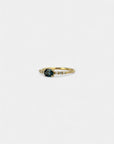 Ring with teal blue sapphire and white diamonds