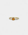 Ring with orange sapphire and white diamonds
