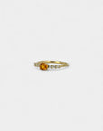 Ring with orange sapphire and white diamonds