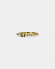 Ring with round green sapphire and white diamonds