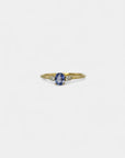Ring with central indigo sapphire and white diamonds