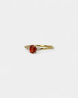 Ring with central orange sapphire and white diamonds