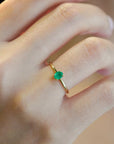 Yellow gold ring with vertical oval emerald