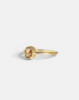 Yellow gold ring with champagne diamond and decorated bezel