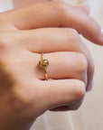 Yellow gold ring with champagne diamond and decorated bezel