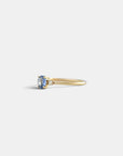 Ring with light blue sapphire and white diamonds