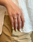 Ring with orange sapphire and white diamonds