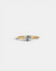 Ring with central light blue sapphire and white diamonds