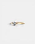Ring with central light blue sapphire and white diamonds
