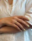 Ring with round green sapphire and white diamonds