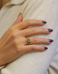 Ring with oval green sapphires and white diamonds