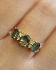 Ring with oval green sapphires and white diamonds