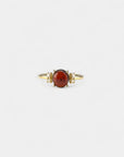 Yellow gold ring with cabochon garnet and white diamonds