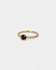 Yellow gold ring with cabochon garnet and white diamonds