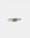Yellow gold ring with blue sapphire and round elements with white diamonds