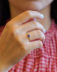 Yellow gold ring with blue sapphire and round elements with white diamonds