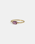 Yellow gold ring with pink sapphire and round elements with white diamonds