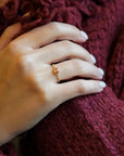 Yellow gold ring with yellow sapphire and round elements with white diamonds