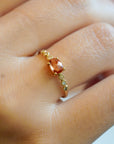 Yellow gold ring with yellow sapphire and round elements with white diamonds