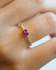 Yellow gold ring with ruby and round elements with white diamonds