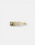Yellow gold ring with green sapphire and round elements with white diamonds