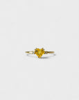 Yellow gold ring with heart-shaped yellow synthetic corundum and two white diamonds