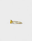Yellow gold ring with heart-shaped yellow synthetic corundum and two white diamonds