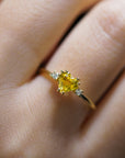 Yellow gold ring with heart-shaped yellow synthetic corundum and two white diamonds