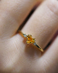 Yellow gold ring with heart-shaped orange corundum and two white diamonds