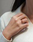 Yellow gold ring with orange heart-shaped synthetic corundum and two white diamonds