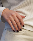 Yellow gold ring with round profile of white diamonds
