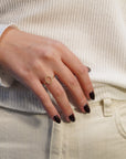 Yellow gold ring with oval profile of white diamonds