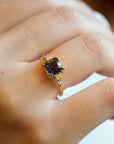 Yellow gold ring with square iolite and white diamonds