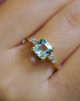 Yellow gold ring with square blue topaz and white diamonds