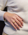 Yellow gold ring with square lemon quartz and side peridots