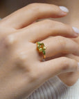 Yellow gold ring with square lemon quartz and side peridots