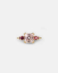 Yellow gold ring with square rose quartz and side rhodolites and tourmalines