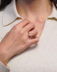 Yellow gold ring with square rose quartz and side rhodolites and tourmalines