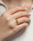 Yellow gold ring with rectangular peridot and white diamonds