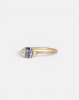 Yellow gold ring with cornflower blue sapphire and white diamonds