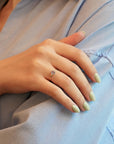 Yellow gold ring with cornflower blue sapphire and white diamonds