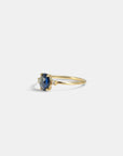 Yellow gold ring with oval rose-cut blue sapphire and white diamonds