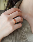 Yellow gold ring with oval rose-cut orange sapphires and white diamonds