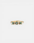 Yellow gold ring with square teal tourmalines and white diamonds