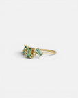 Yellow gold ring with tilted teal tourmalines and white diamonds