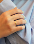 Mini signet yellow gold ring with diamonds on the sides