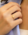 Mini signet yellow gold ring with diamonds on the sides