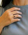 Yellow gold ring with oval rhodolite and white diamond contour
